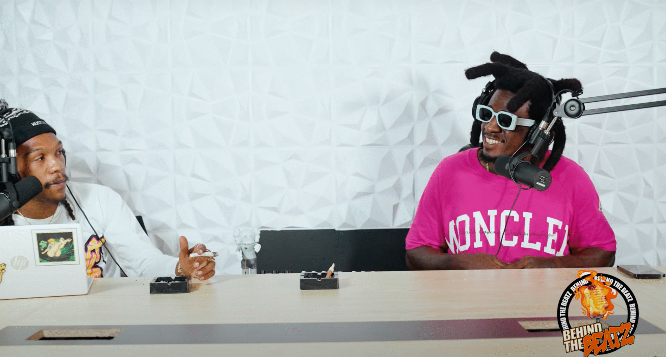 Mr. Lost in Miami and the Behind The Beatz podcast host discussing music, real estate, and networking while seated at a studio table.